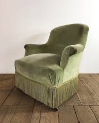 antique green armchair